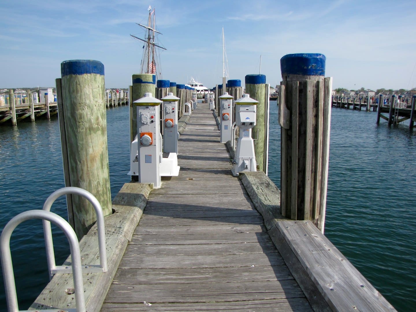 A weathered wooden pier extending into calm water